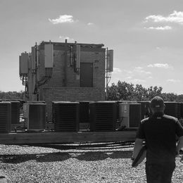 Elevator Technician on Building Roof