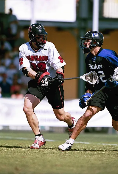 Picture of Coach  Carrington King playing defense in college at University of Maryland