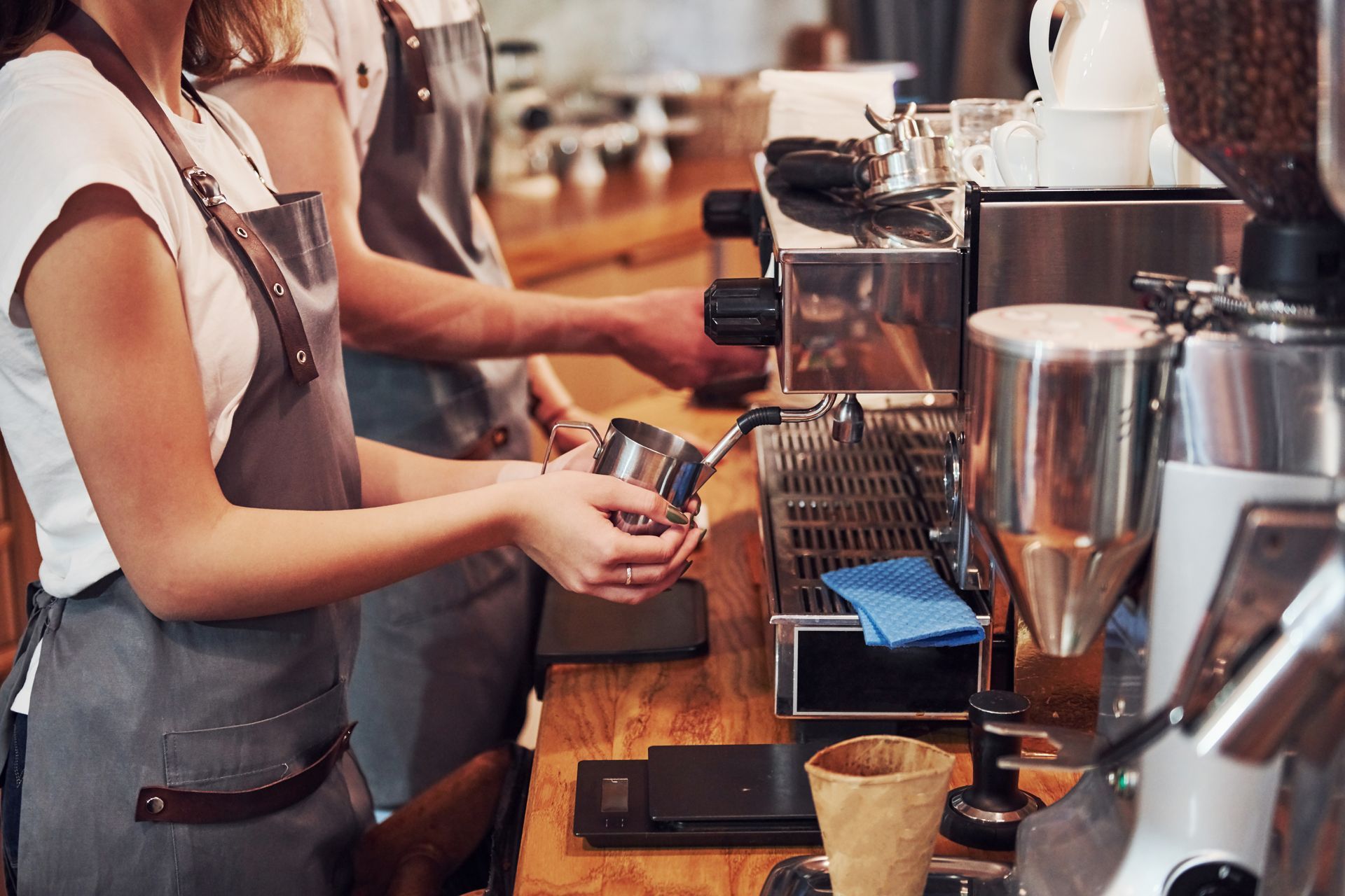 A group of people are working in a coffee shop.