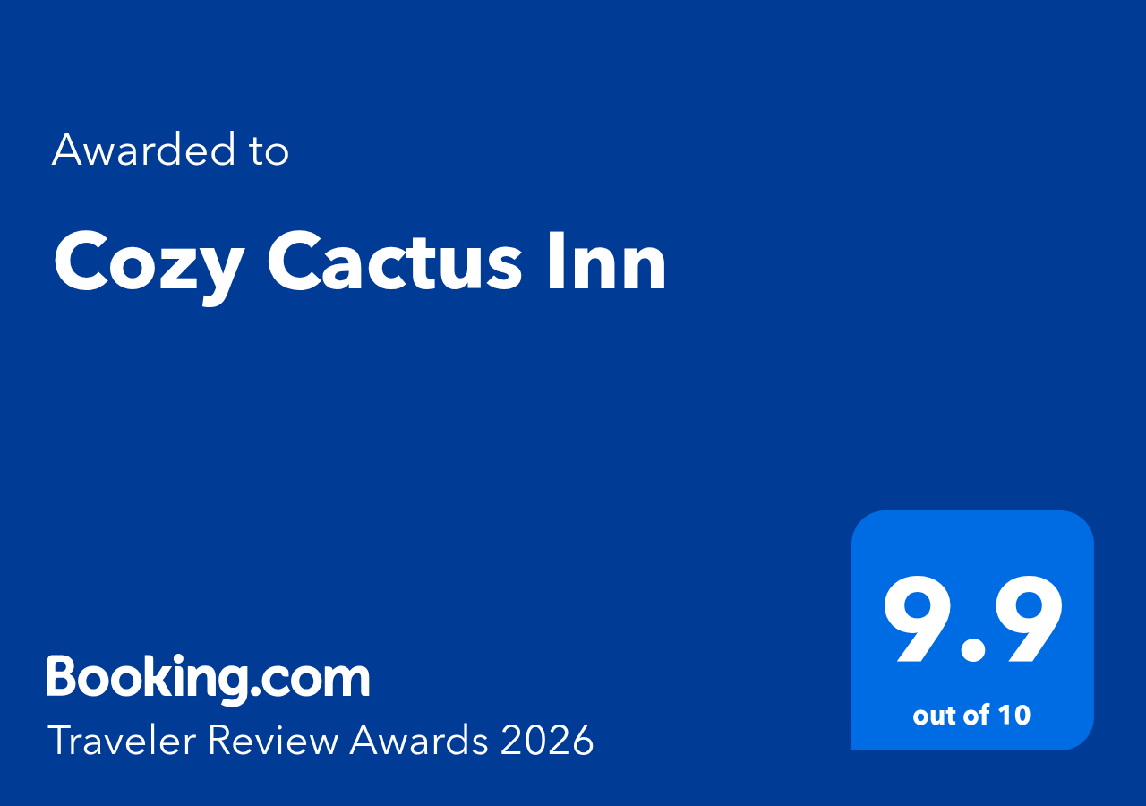 Booking.com award for Cozy Cactus Inn. Blue background with white text, rating 9.9 out of 10.