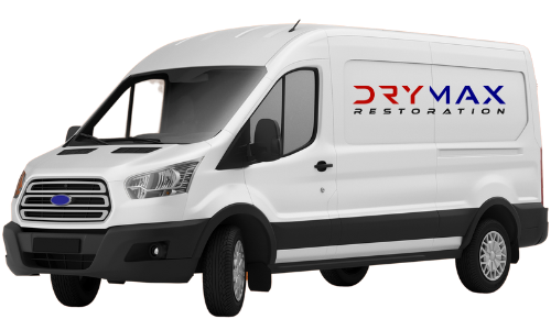A white van with the word drymax restoration on the side.