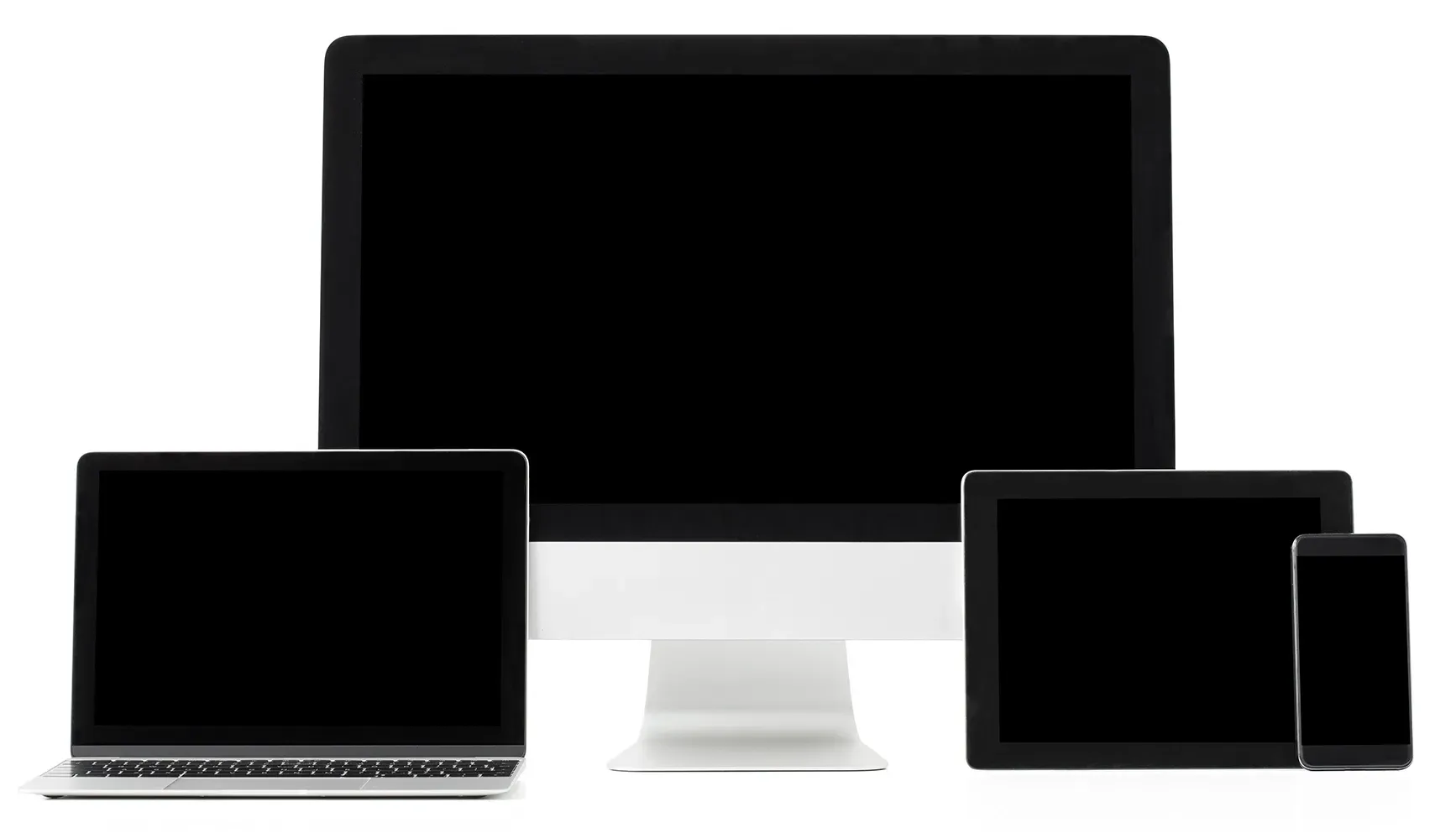A computer , laptop , tablet and cell phone are sitting next to each other on a white background.