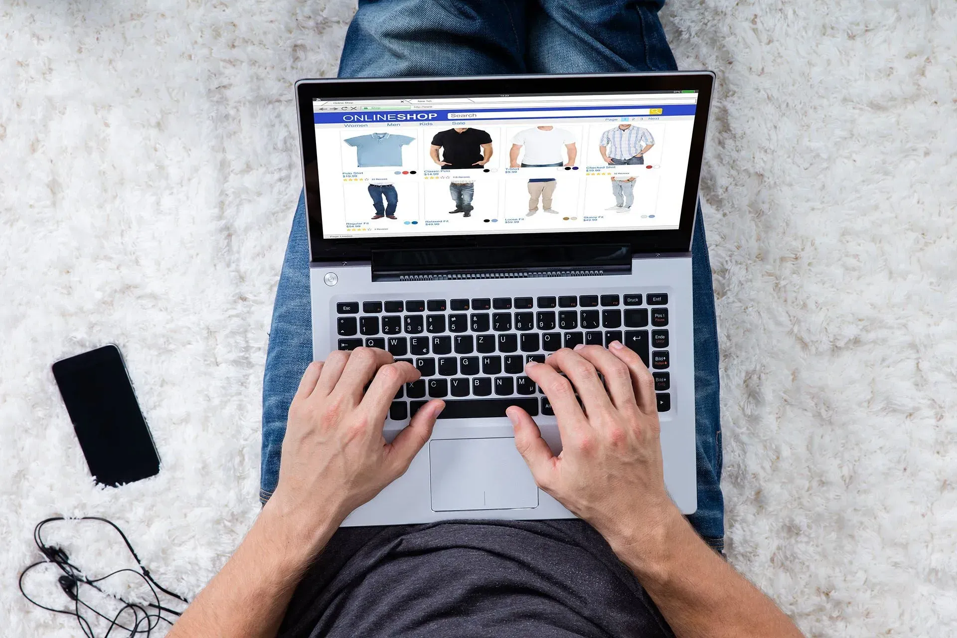 man looking at online store on laptop