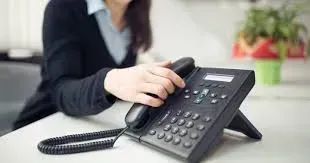 a woman picking up the phone