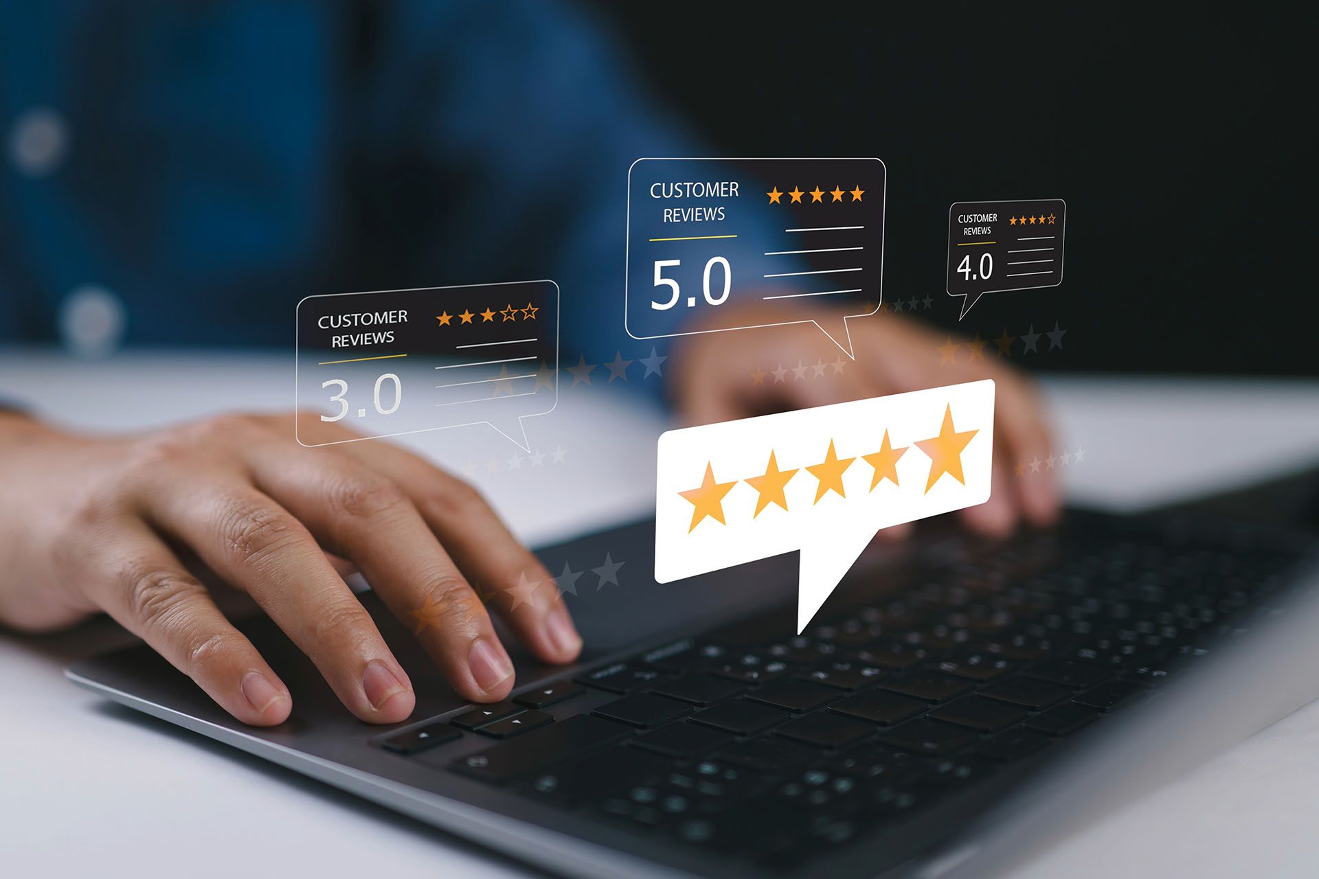 A person is typing on a laptop computer with a speech bubble that says five stars.