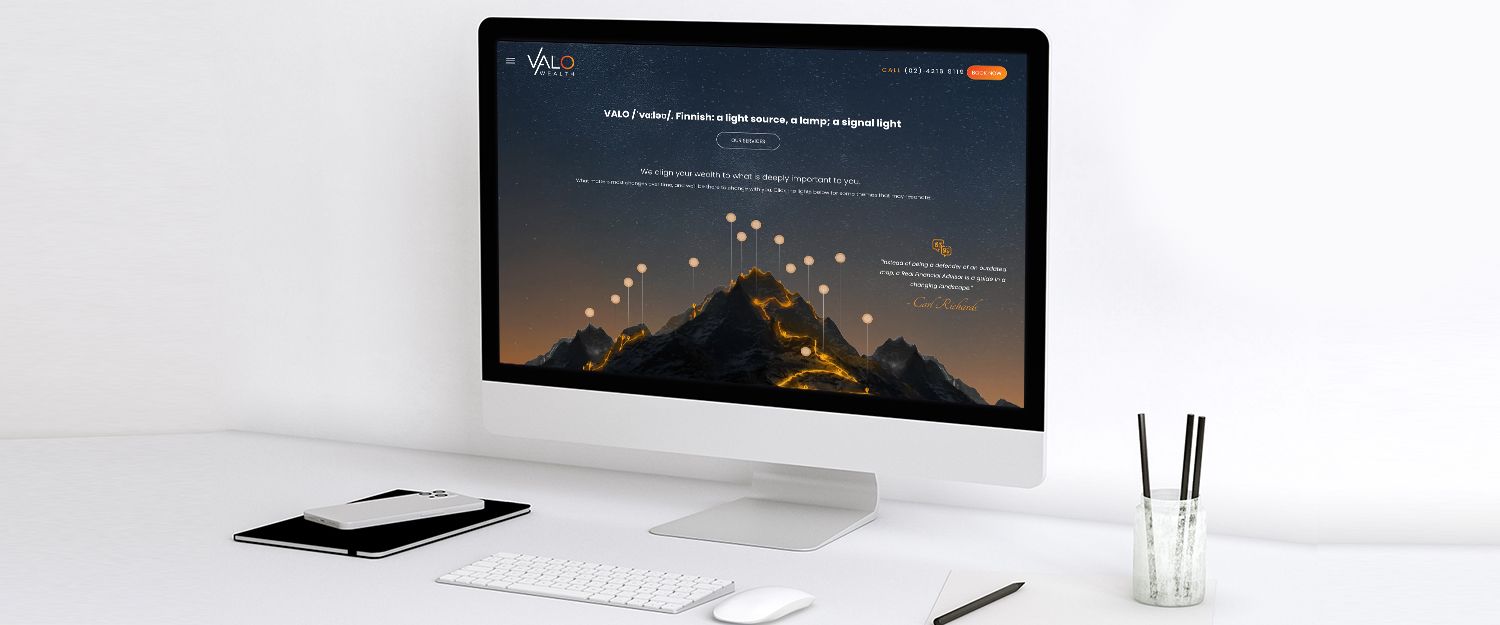 Valo Wealth website on monitor