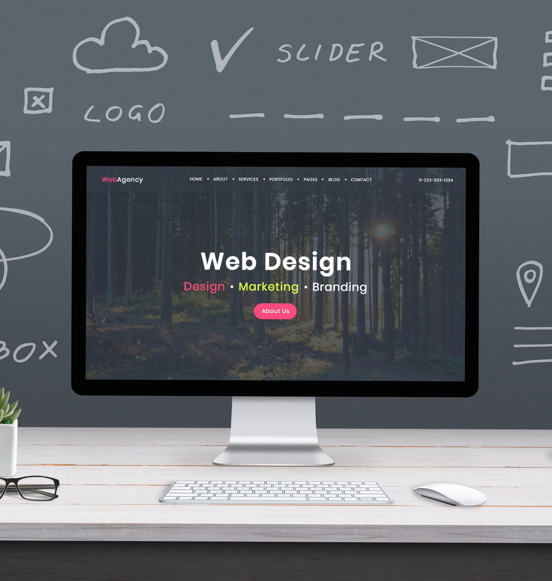 A computer is sitting on a desk with a web design website on the screen.