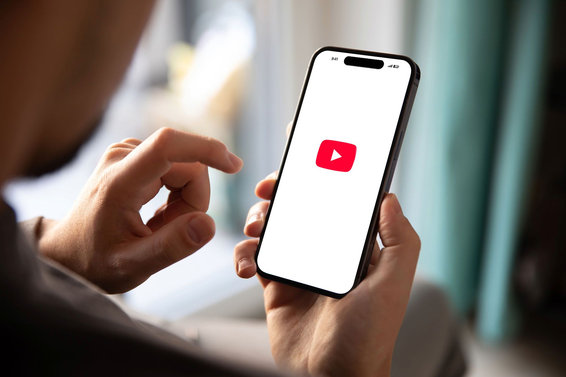 man opening YouTube app
