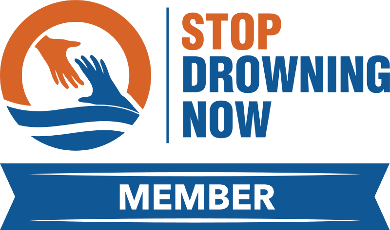 Stop Drowning Now member logo with orange and blue hand graphic and blue ribbon banner