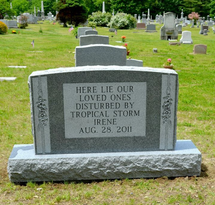 Memorial gravestone in a cemetery, engraved with tribute to loved ones lost in Tropical Storm Irene, Aug. 28, 2011