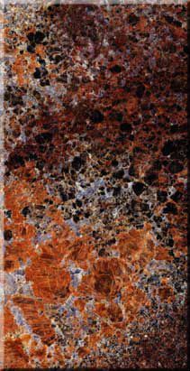 Abstract marbled texture with mottled black, rust, orange, and white speckles