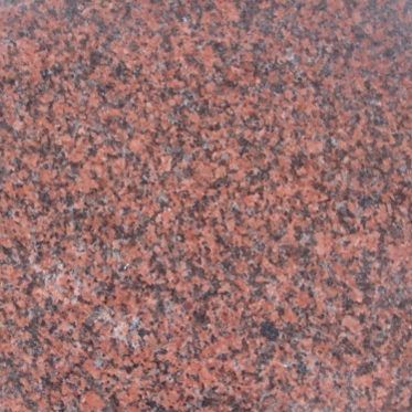 Close-up of a pink and gray speckled granite surface