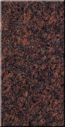 Dark speckled brown and black textured surface.