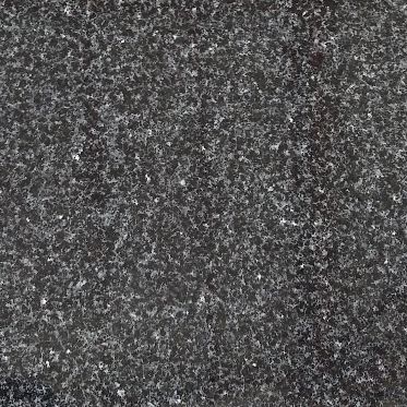 Dark gray speckled stone or granite texture with a faint vertical seam