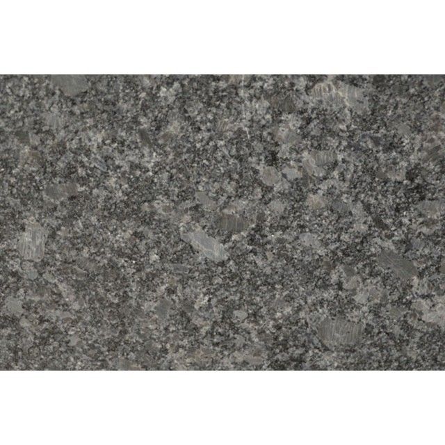 Gray speckled granite texture with a small light patch in the center