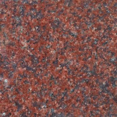 Close-up of red and gray speckled stone texture