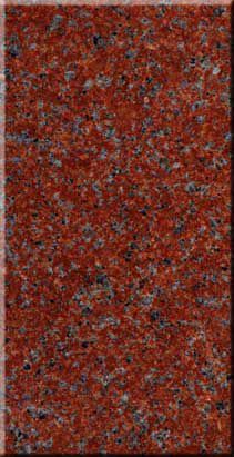 Red and gray speckled textured surface, resembling granite or stone.