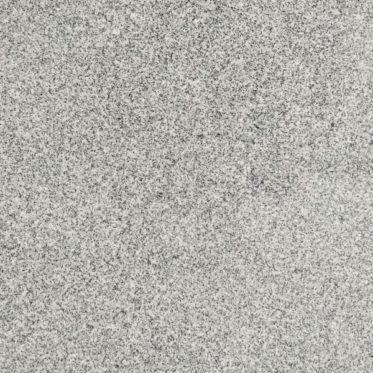 Gray speckled stone or concrete surface texture