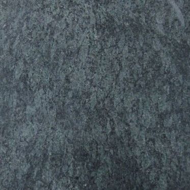 Close-up of a dark gray stone or concrete textured surface