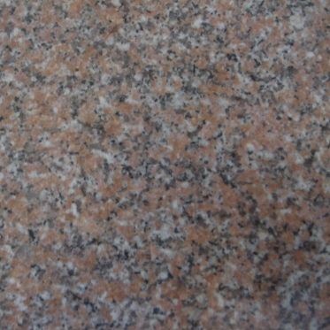 Close-up of pink and gray speckled granite surface