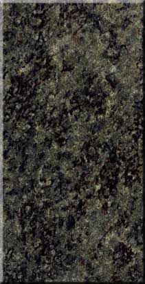 Close-up of a dark green and black speckled stone surface