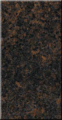 Dark speckled stone or granite surface with brown, black, and gray mottling.