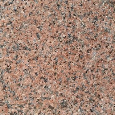 Pink and gray speckled granite surface texture