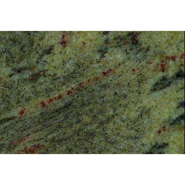 Close-up of green-gray stone with red speckles and diagonal dark veining