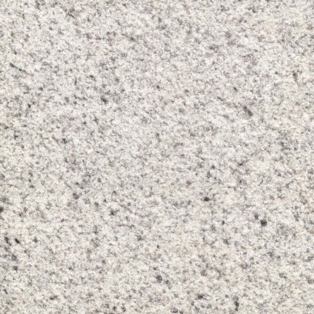 Light gray speckled stone surface texture