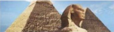 Sphinx beside the Great Pyramid under a blue sky