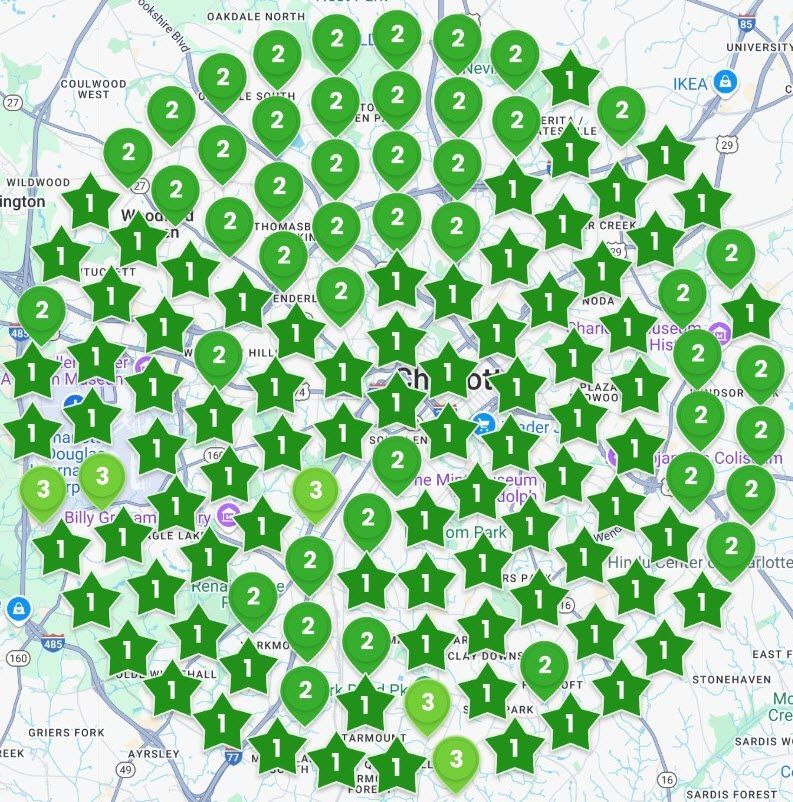 Map with many green and dark-green location pins clustered across a city area.