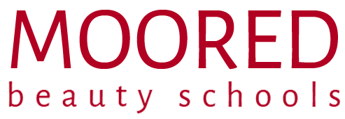 Moored beauty schools logo in red text on a white background