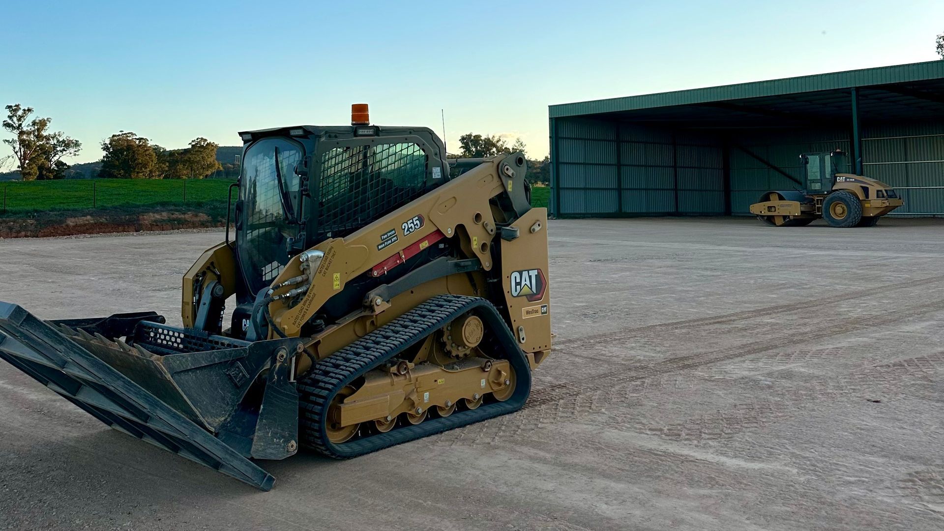 Posi Track at work on shed pad apron & bulk earthworks in Cowra NSW – shed site prep & levelling.