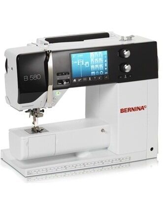 White Bernina sewing machine with blue display and black control panel