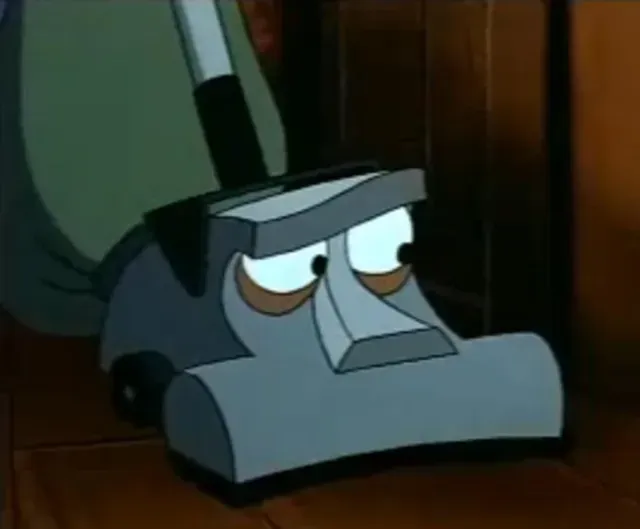 Animated vacuum cleaner with sad eyes sitting on a wooden floor in a dim room