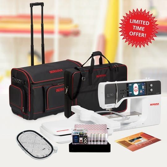 Travel medical kit with black cases, diagnostic device, test strips, and blood pressure cuff on a white background
