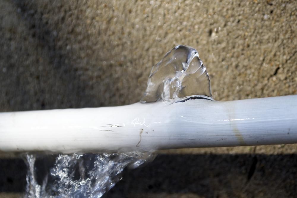 Water Is Coming out Of a Hole in A Pipe — Top To Bottom Plumbing in Garbutt, QLD