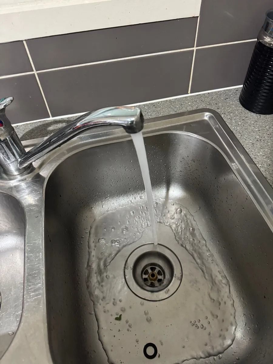 Faucet Pours Water to Sink in Townsville