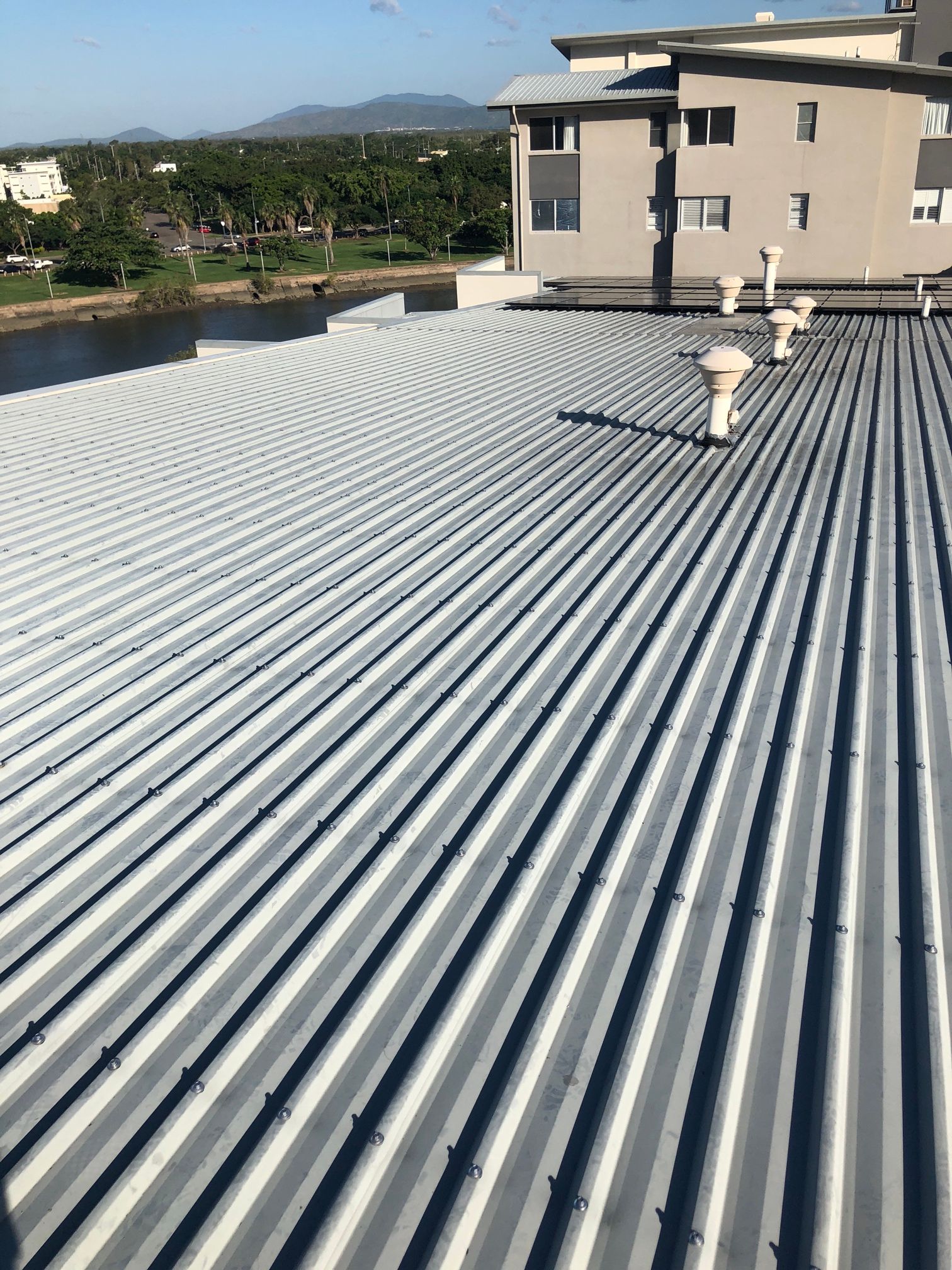 A House with A Metal Roof and A Window — Top To Bottom Plumbing in Garbutt, QLD