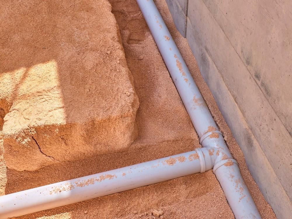 A Pvc Pipes on The Ground — Barry Brown Rural Contracting Service in Wingham, NSW