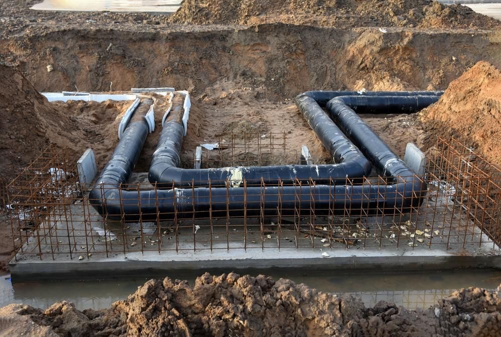 A Black Pipes in A Trench — Barry Brown Rural Contracting Service in Tinonee, NSW