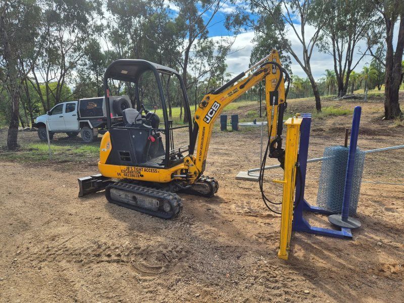 Yellow Excavator With a Wire Dispenser — Barry Brown Rural Contracting Service in Tinonee, NSW