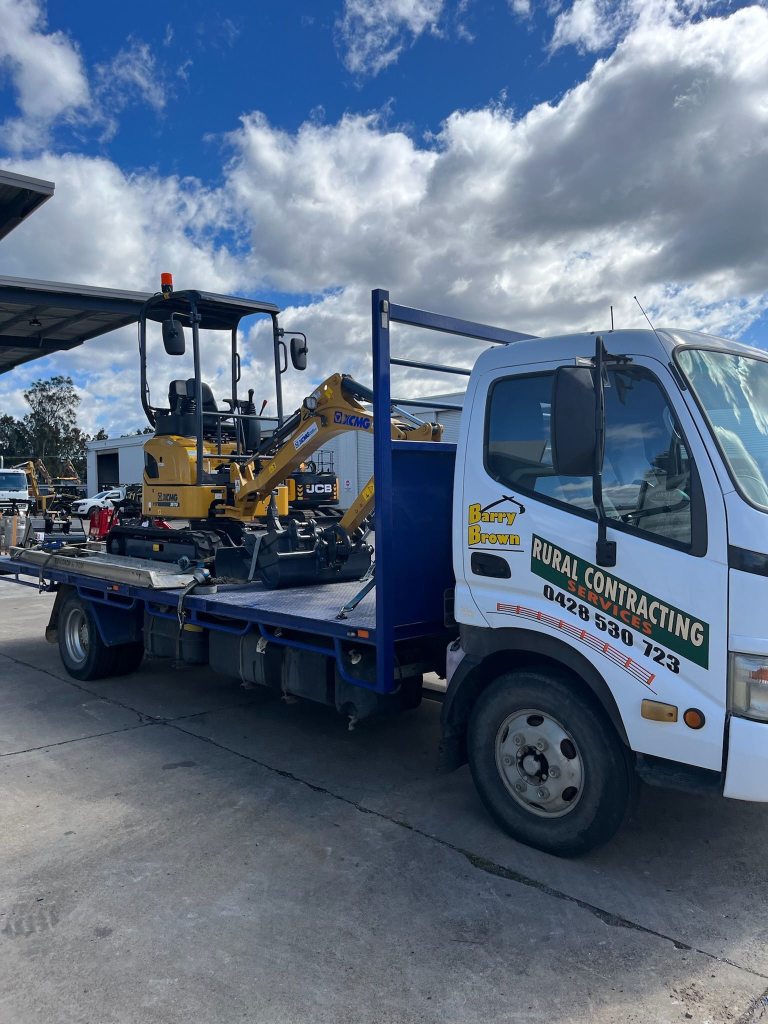 A Gravel Driveway  Surrounded by Rocks — Barry Brown Rural Contracting Service in Tinonee, NSW