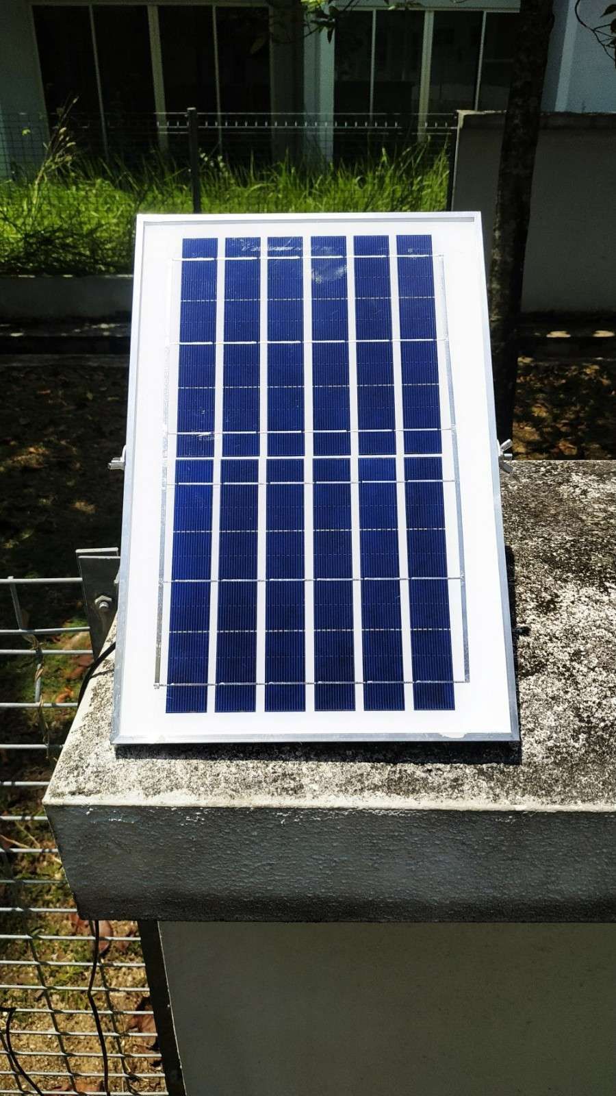 A Solar Panel Mounted on A Cement Structure — Barry Brown Rural Contracting Service in Tinonee, NSW