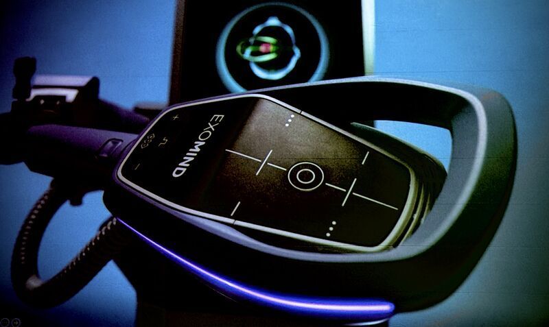 Black Exomind device with screen displaying crosshairs; lit blue base, blue background.