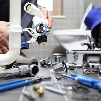 plumber at work in a bathroom