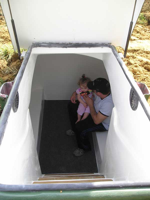 Man and Her Baby Inside the Shelter | Oakland City, IN | Integrity Storm Shelters LLC