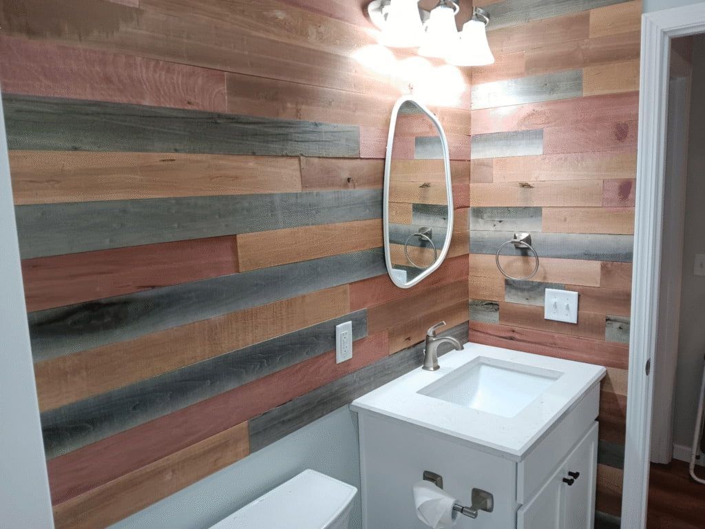 Stylized bathroom with a white tub, shower, mirror, sink, and gold accents