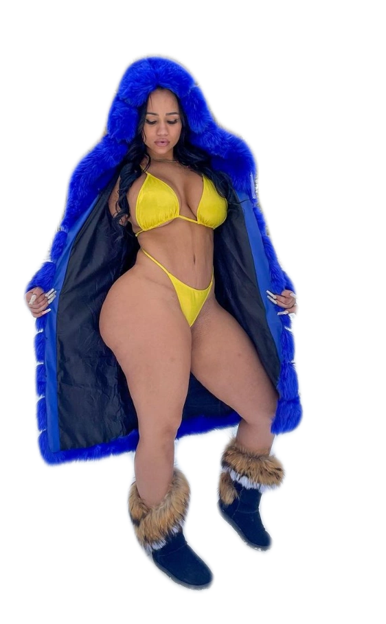 A woman in a bikini is wearing a blue fur coat with a hood.