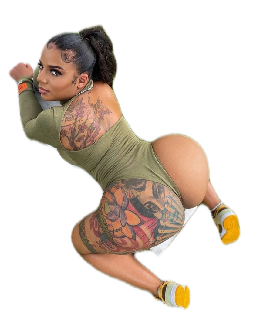 A woman with a lot of tattoos on her body is kneeling down.